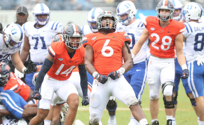 Virginia senior linebacker Nick Jackson celebrates after making a tackle against Duke.
